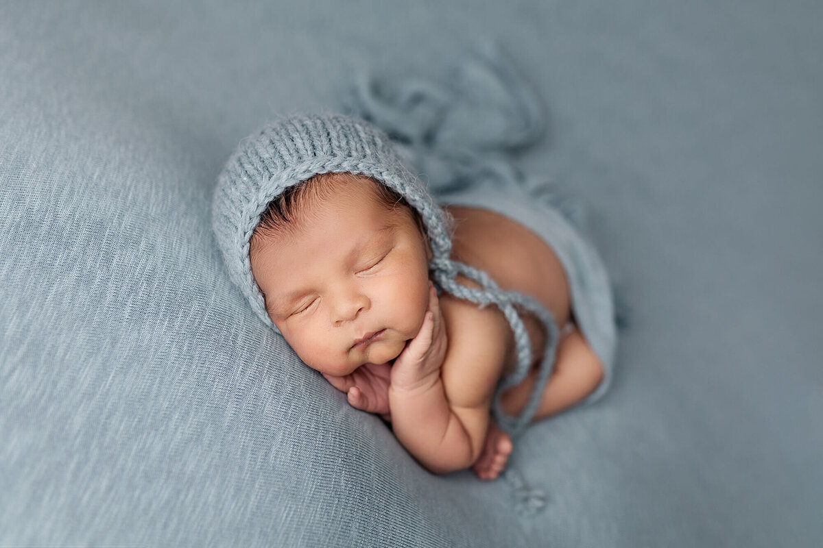 Newborn during his newborn session in Southern Minnesota.