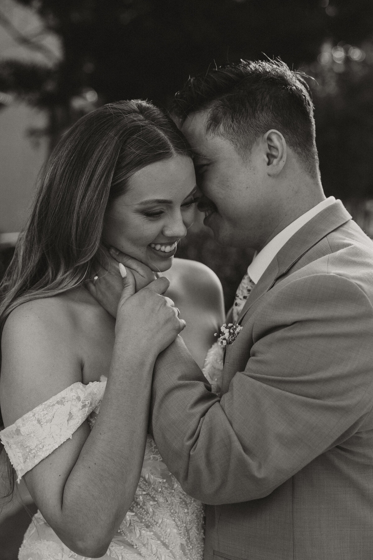 groom holding bride's face