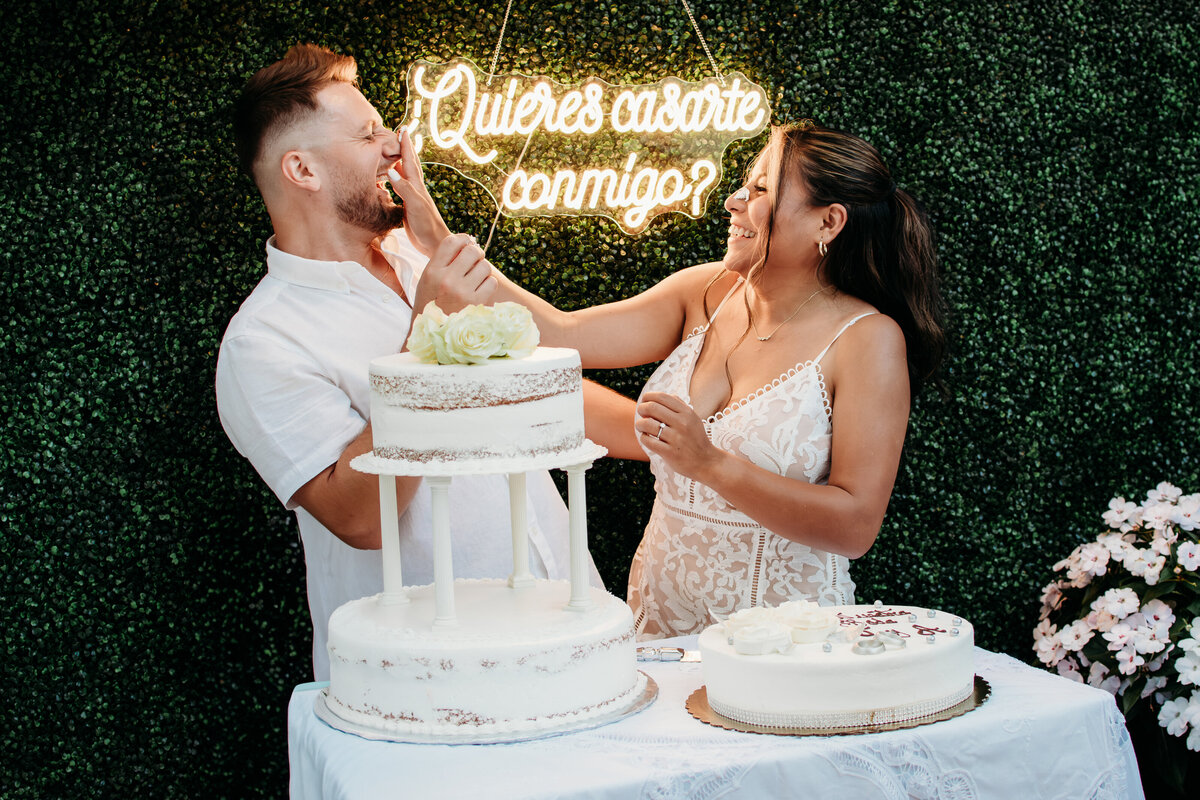 Cutting the cake at their backyard wedding in Streamwood, IL