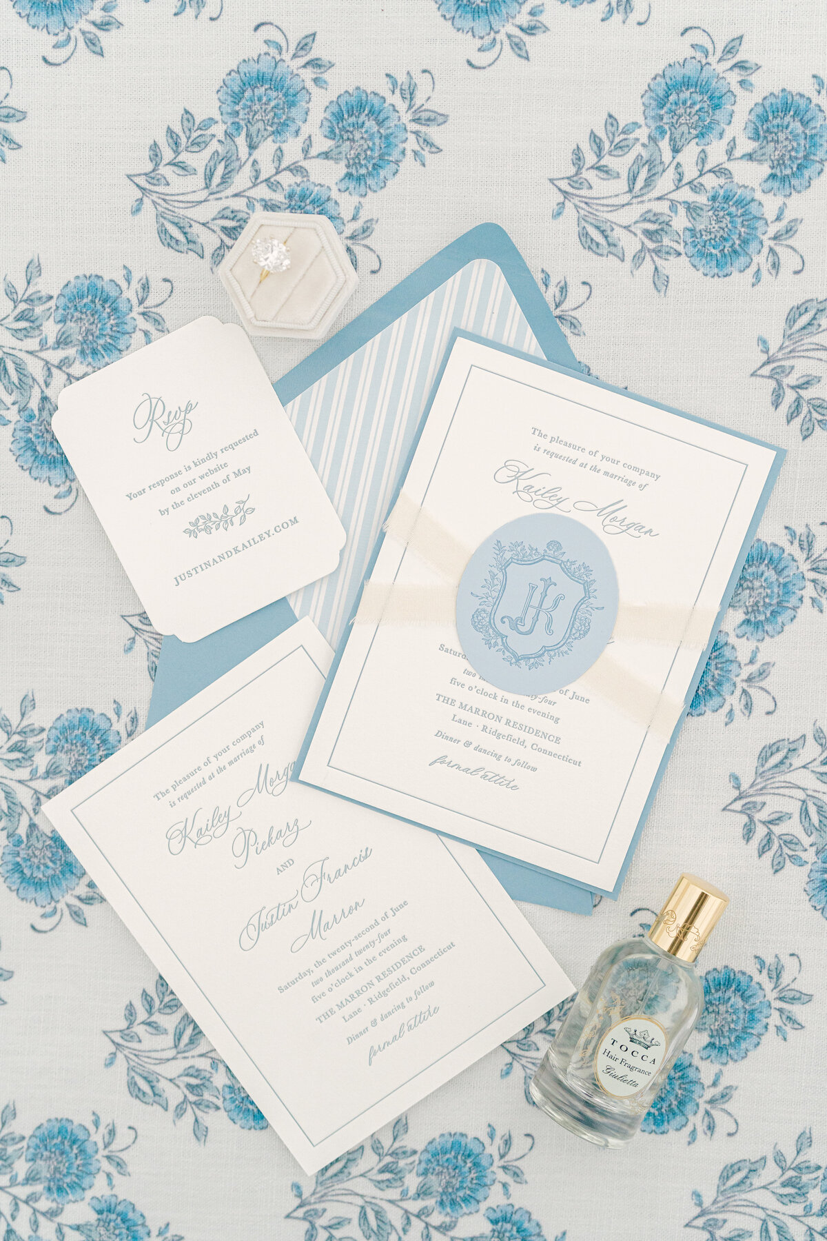 blue letterpress crest wedding invitation