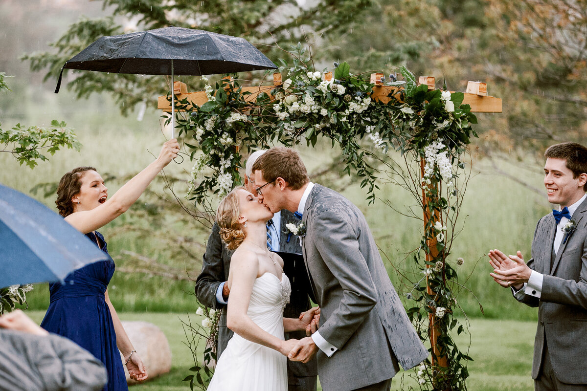 Wedding ceremony kiss taken at Boulder's Greenbriar Inn