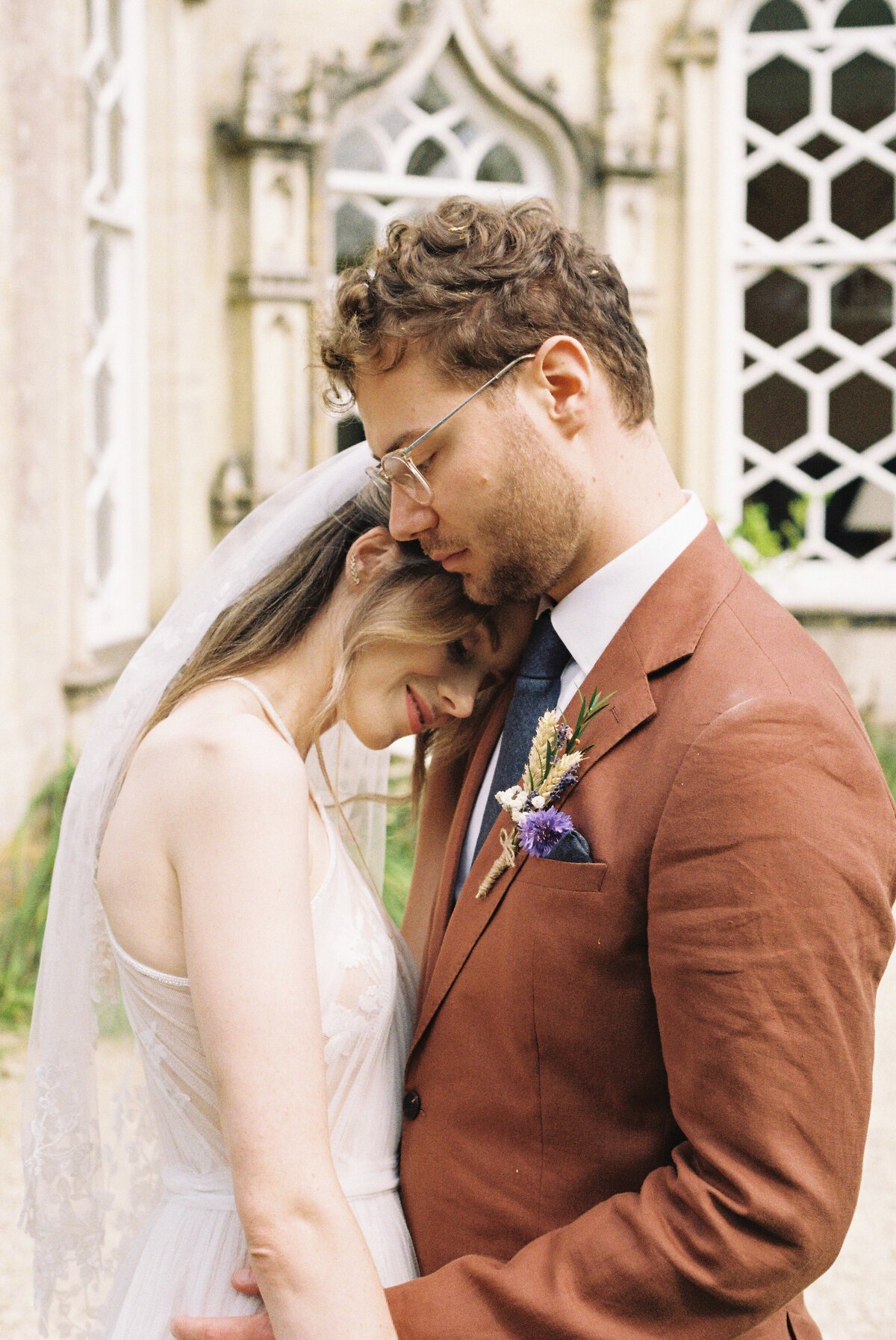 35mm portrait of the bride and groom at the Orangery at Frampton Court Estate, Gloucestershire