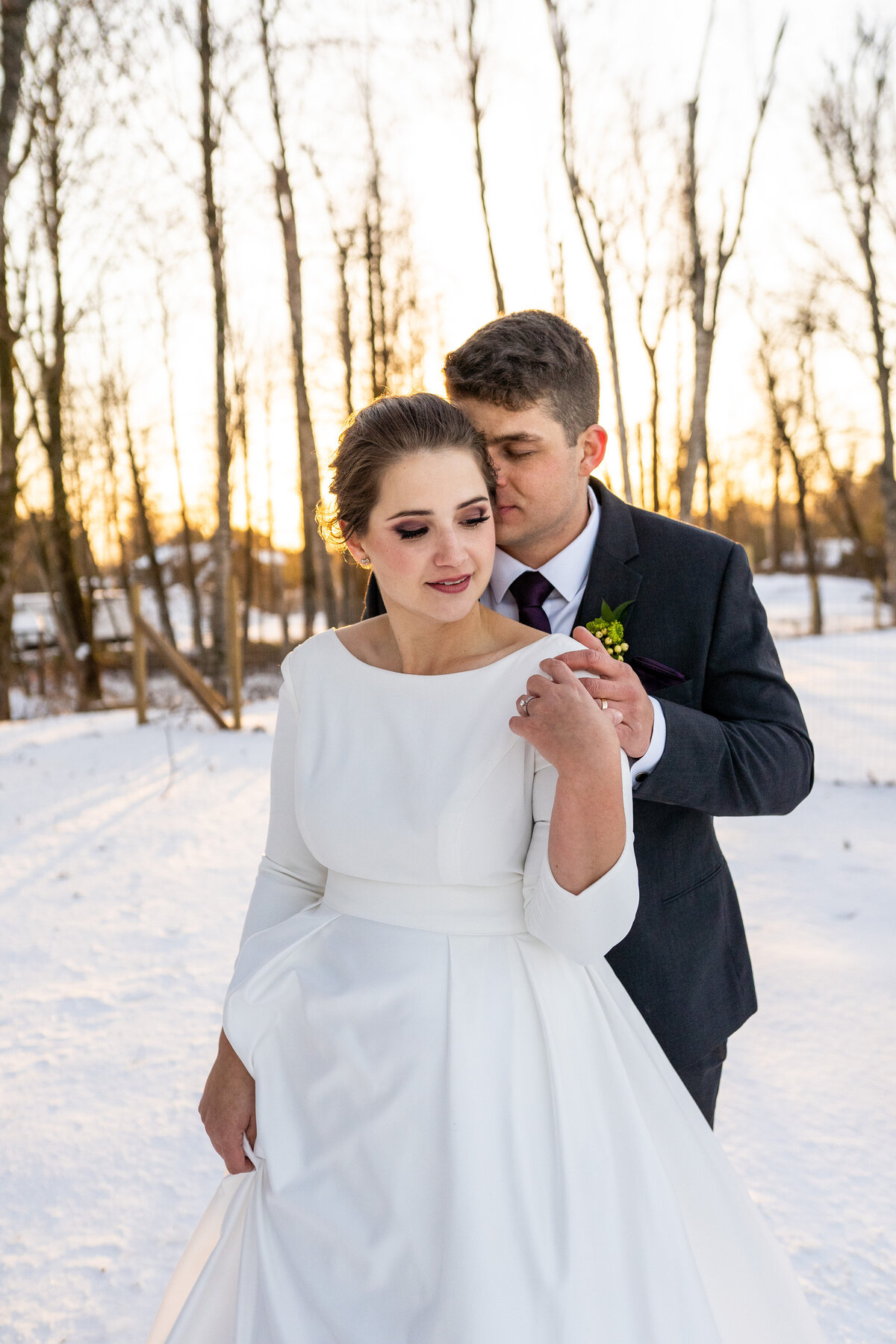 couple at Maan farms during their snowy winter wedding