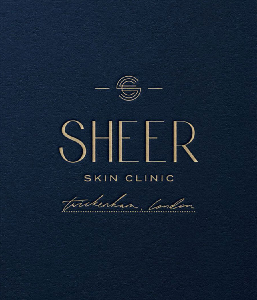 Navy and gold brand identity for a London-based luxury skincare clinic.