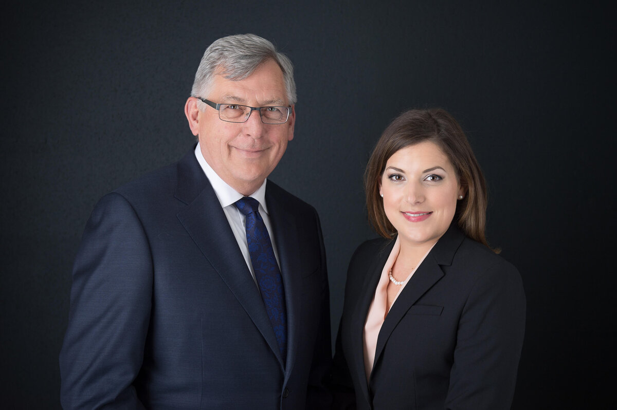 headshots of two lawyers in blue suits taken in studio on a black backdrop by Ottawa Headshot Photographer JEMMAN Photography Commercial