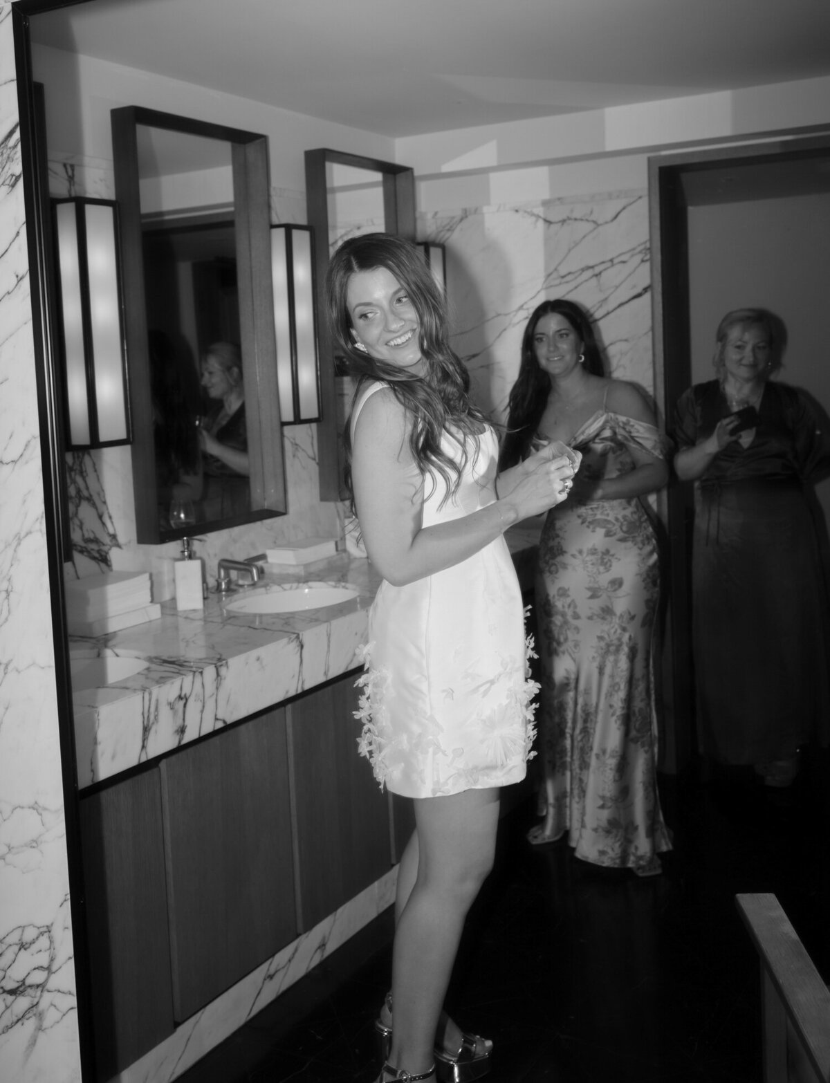 A bride gets ready for her second look, wedding reception dress, Shinola Hotel