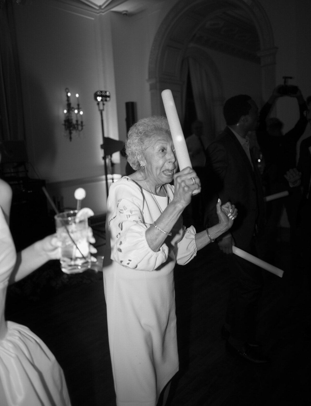 A grandma dances playfully, Colony Club wedding reception in Detroit