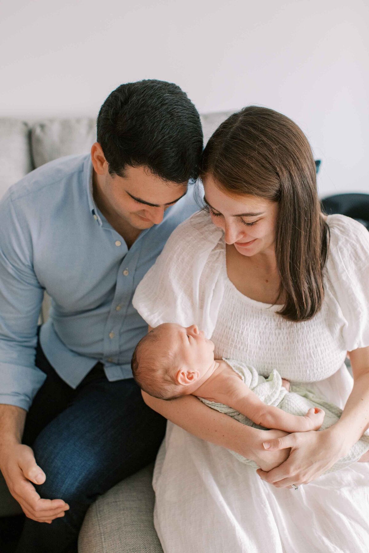 parents looking lovingly at their new baby