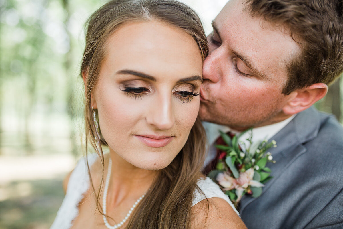 orland-park-wedding-photography-groom-kissing-bride-