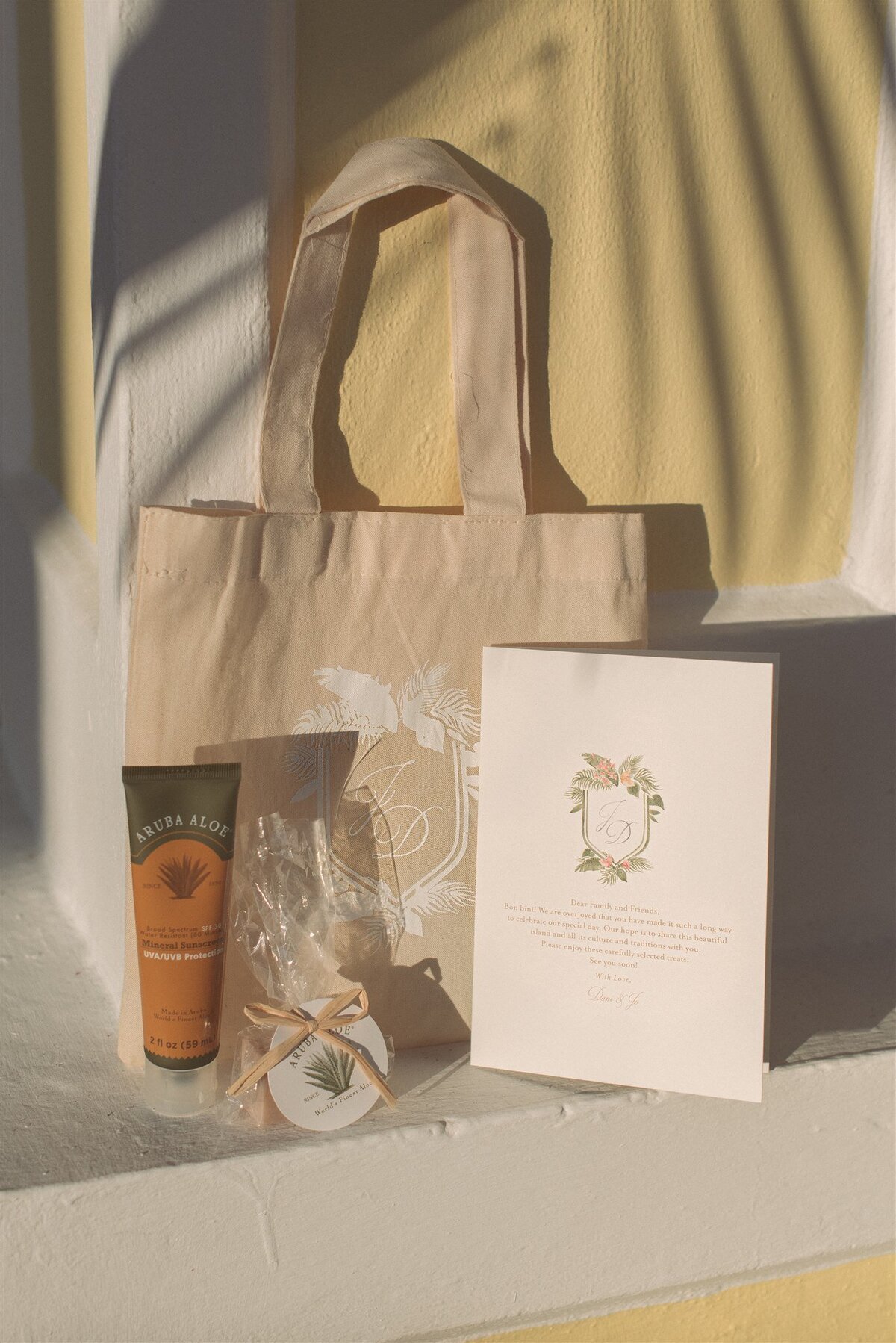 wedding stationery welcome bag including custom tote, custom welcome card and soap and sunscreen from aruba
