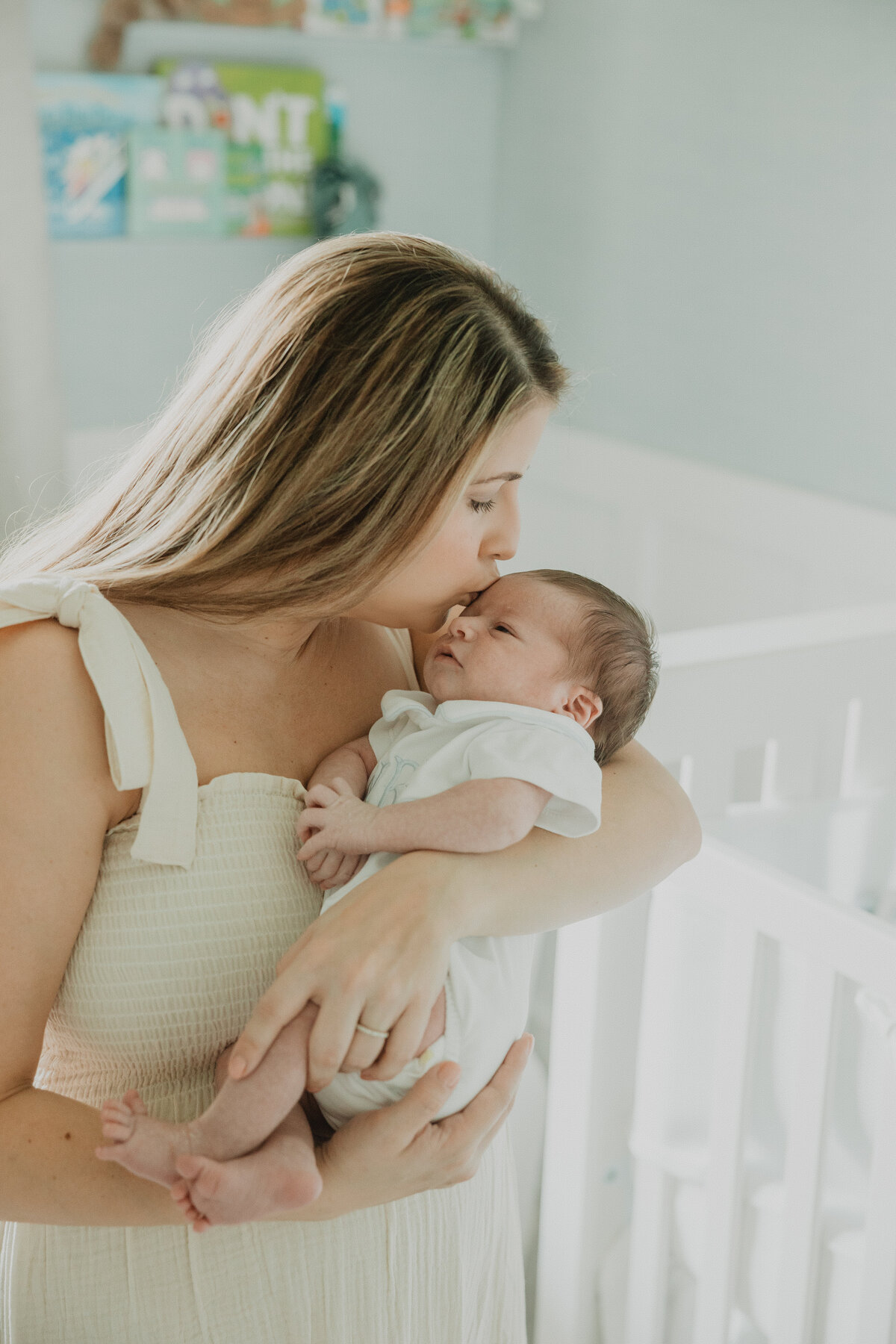mom-kisses-newborn-baby