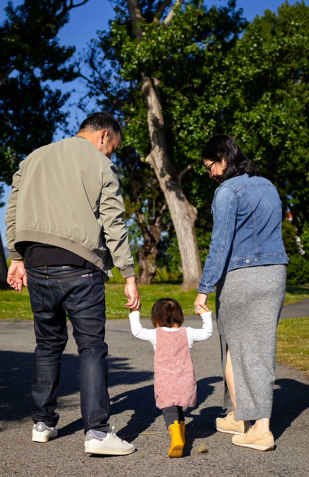 Candid moment of parents and toddler bonding by the San Francisco Bay – natural light family photography by Ellobelle Photography, San Francisco Peninsula Bay Trail Burlingame