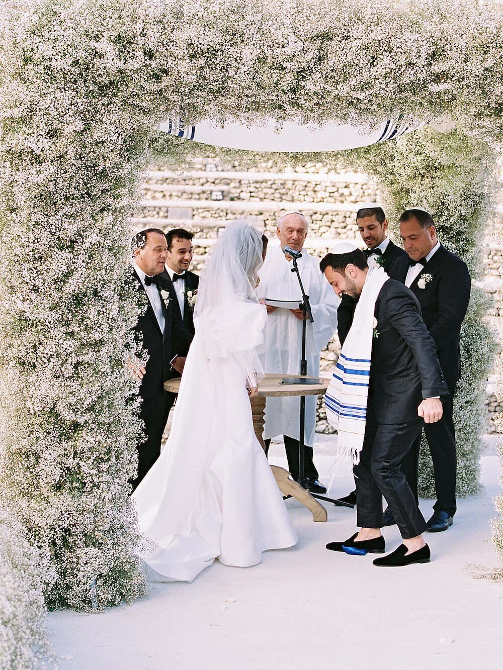 Diverse couple getting married at the alter during their destination wedding