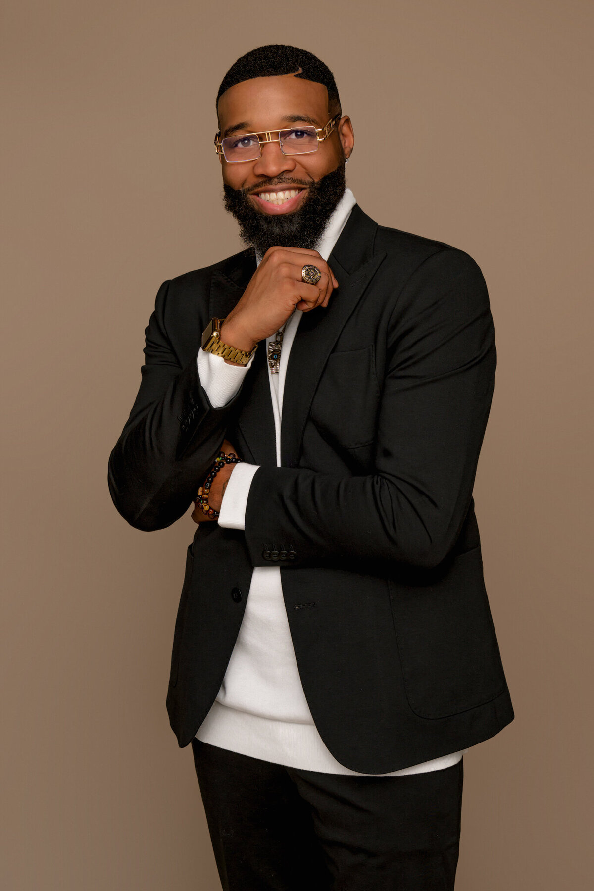 Branding portrait of a BIPOC barber shop owner and entrepreneur photographed in Seattle, created to showcase his professionalism and style for clients seeking authentic, elevated brand imagery.