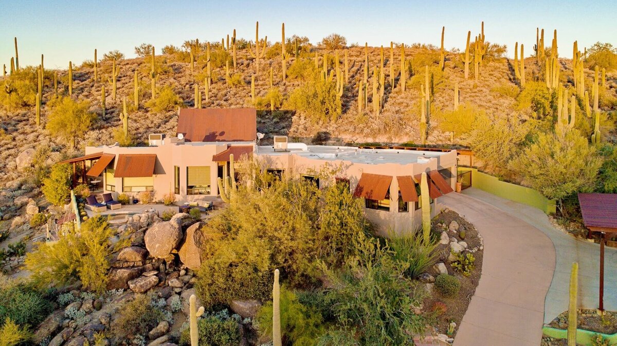 Luxury desert home in Cave Creek, Arizona surrounded by saguaros, used to highlight expert home selling services in Cave Creek, Carefree, and North Scottsdale.