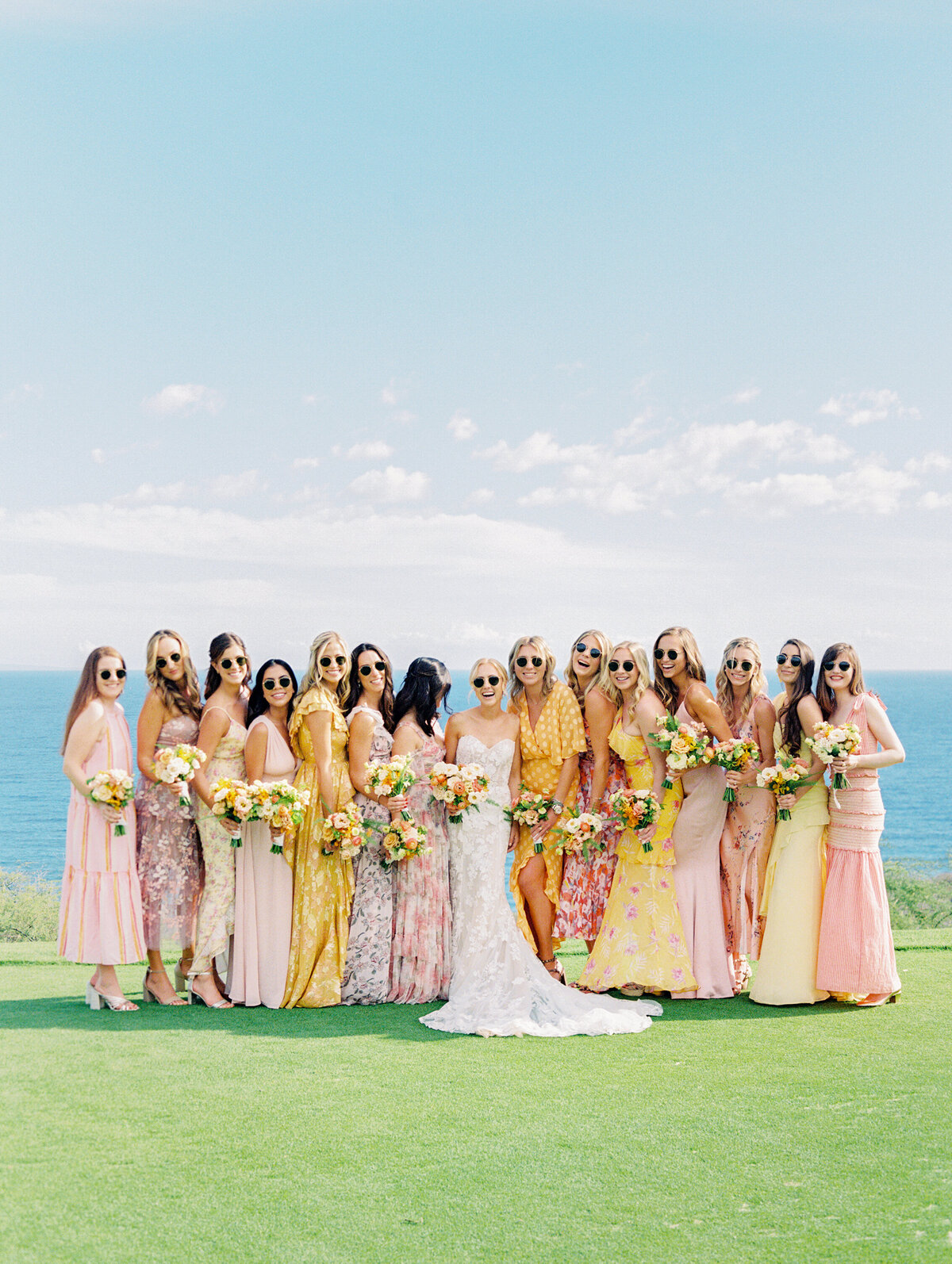 Tropical bride with her beautiful bridesmaids in Four Seasons Lanai Wedding. Lanai, Hawaii.