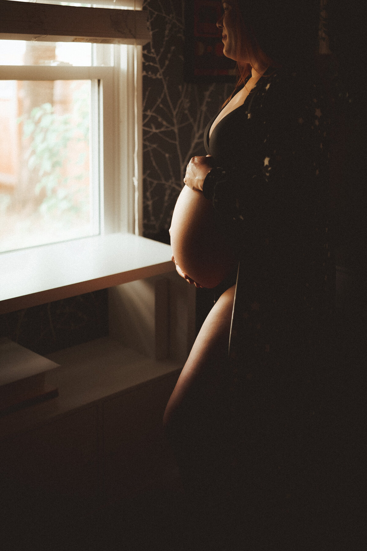 Create a nurtured nest with intimate in-home maternity portraits in St. Paul. Shannon Kathleen Photography brings the essence of your maternal journey to life in the comfort of your own space