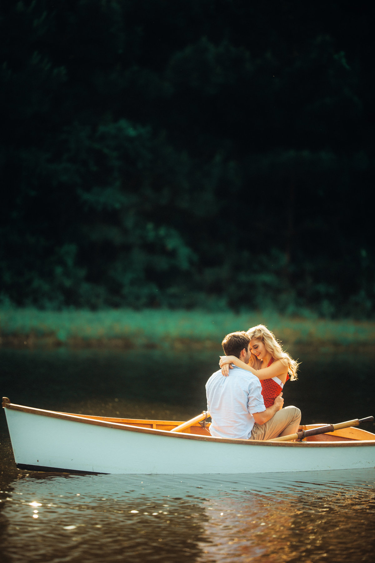 Newly Engaged Couple Embracing On Boat Photography