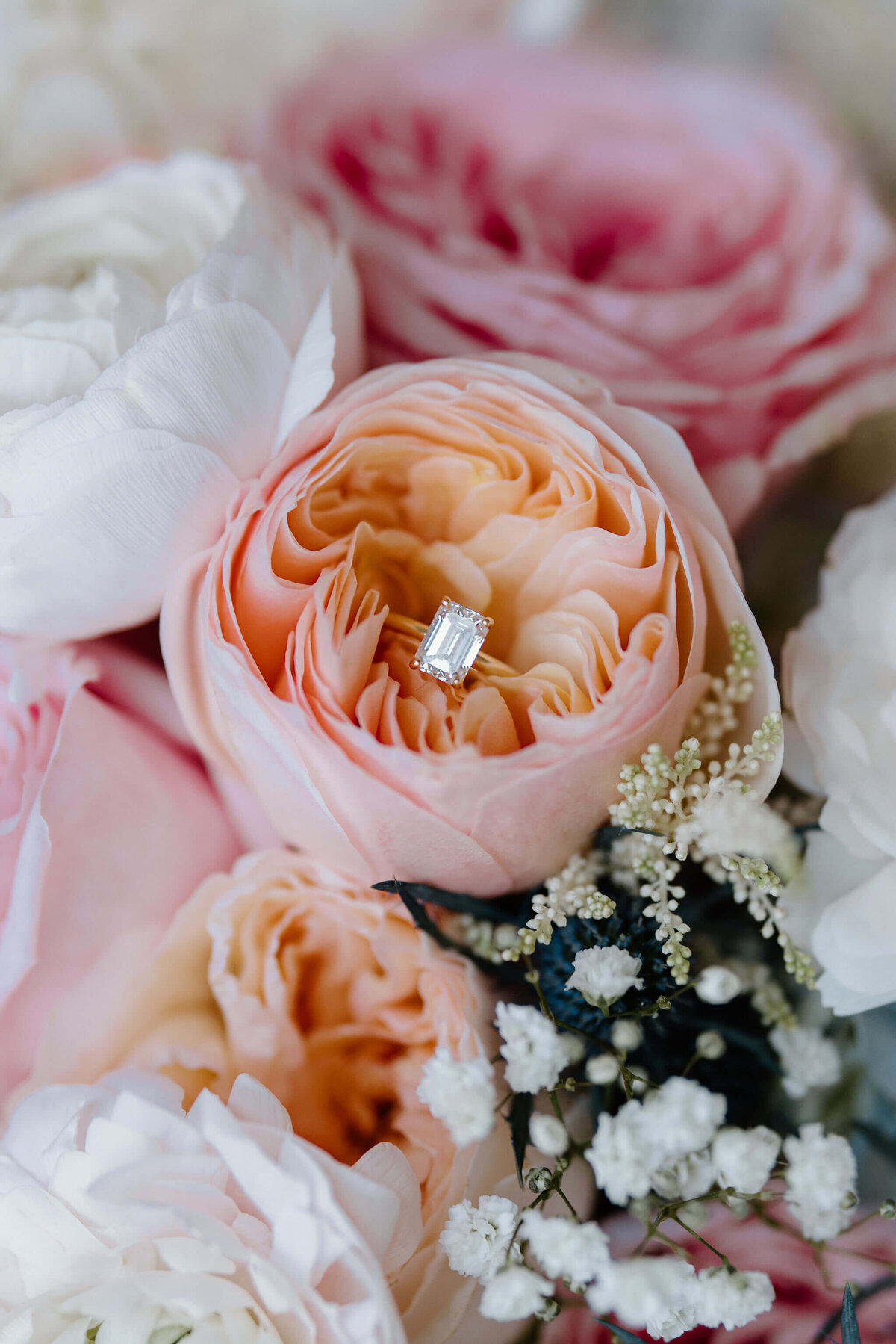 wedding ring photographed in wedding day bouquet