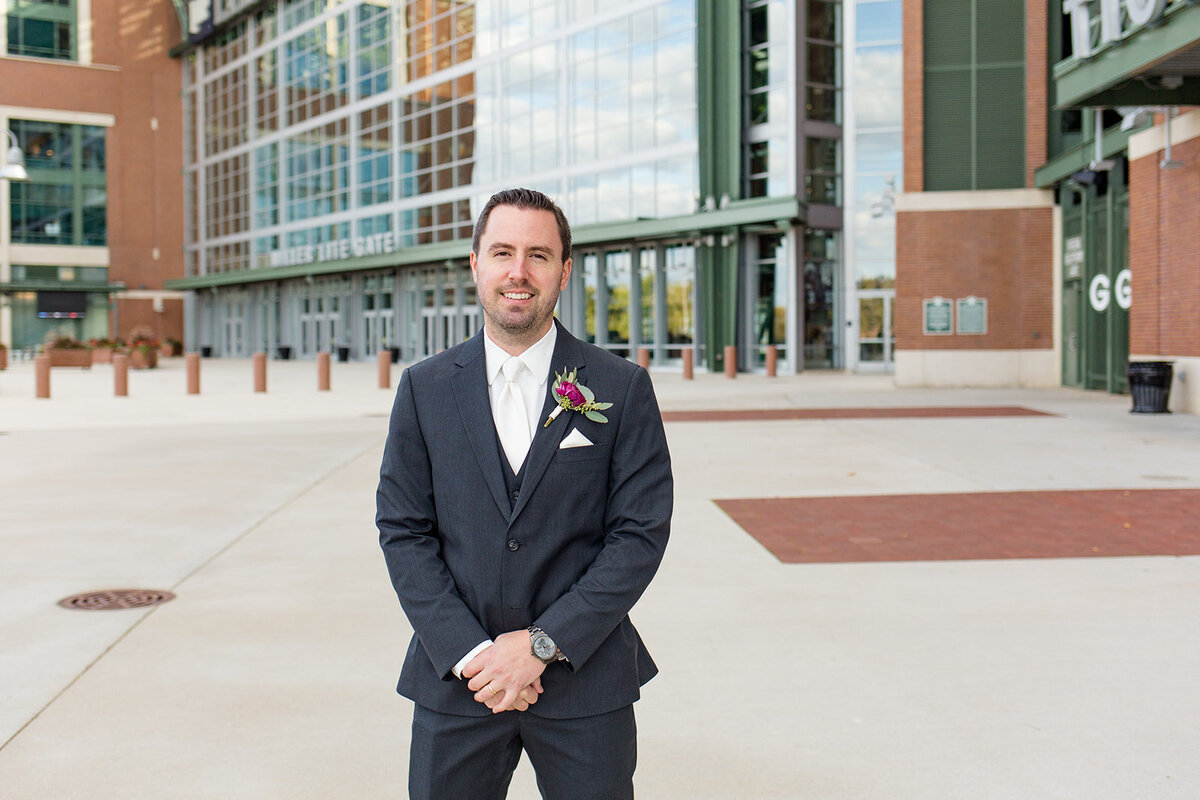 Groom picture outside of atrium at Lambeau Field