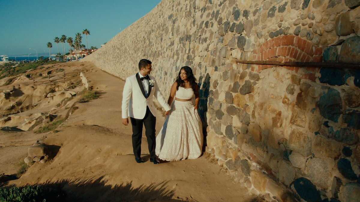 Indian wedding couple walking together