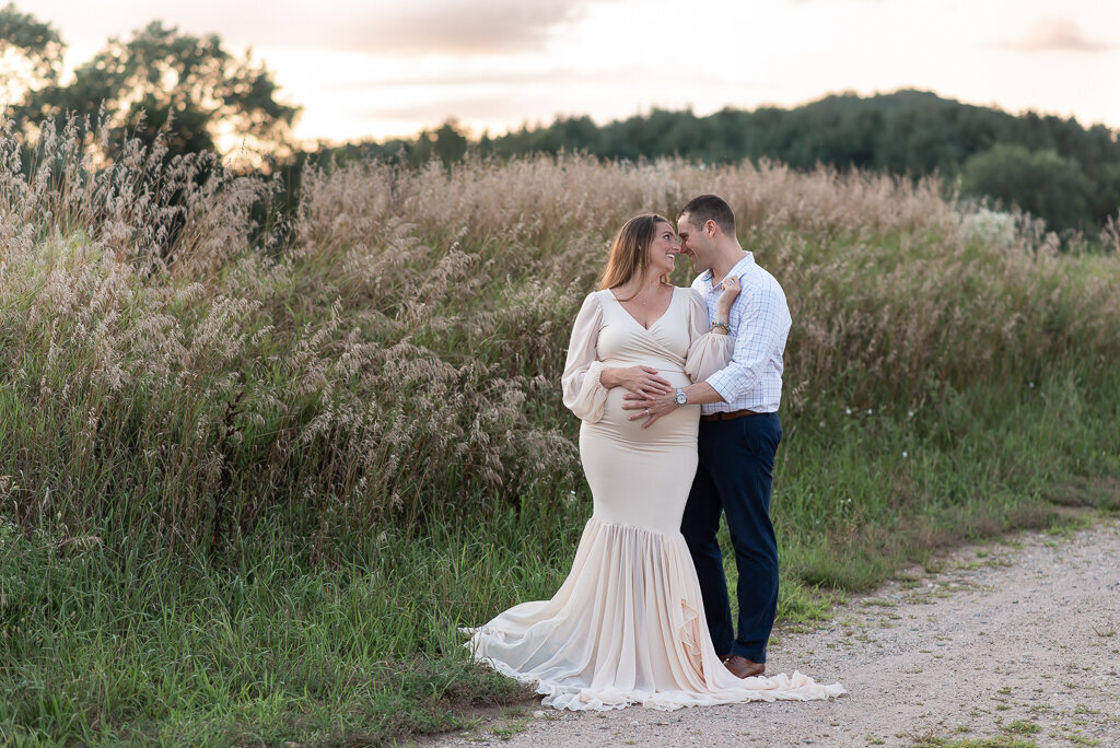Couple looking at each other at sunset maternity session | Sharon Leger Photography | CT Newborn & Family Photographer | Canton, Connecticut