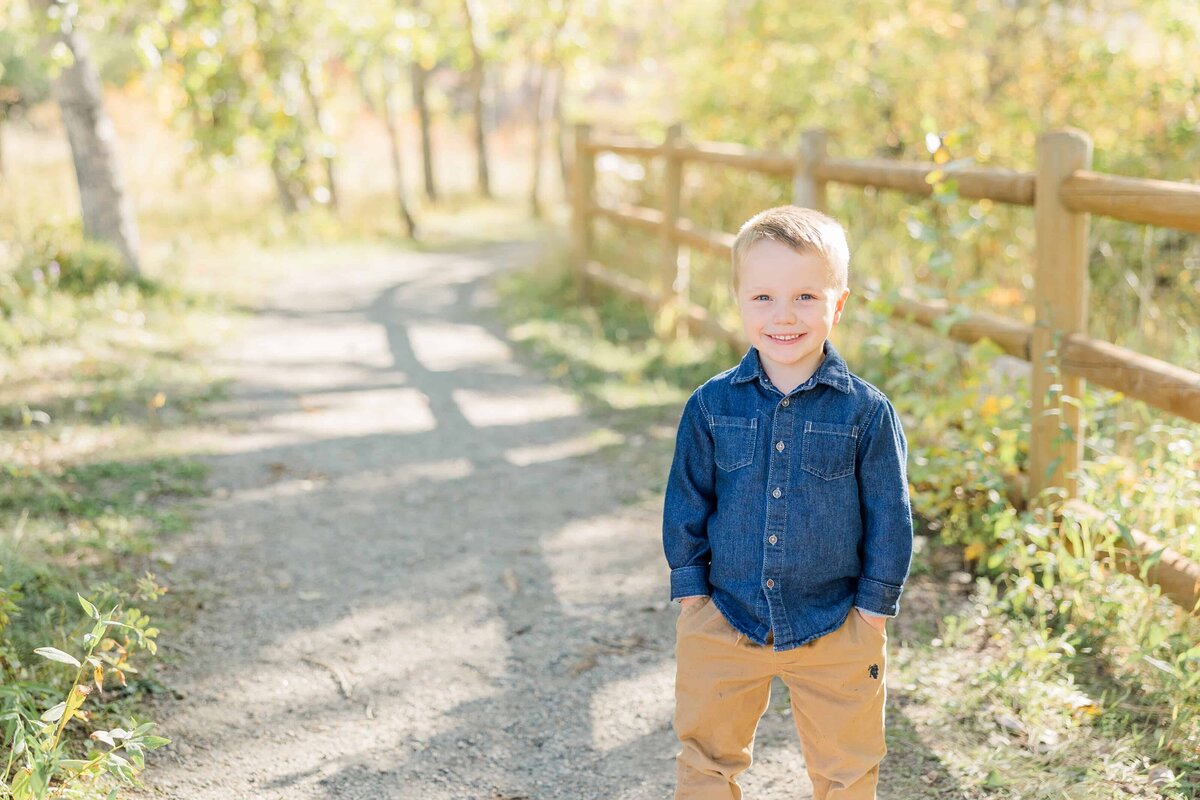portrait of boy with fall leaves, erie co