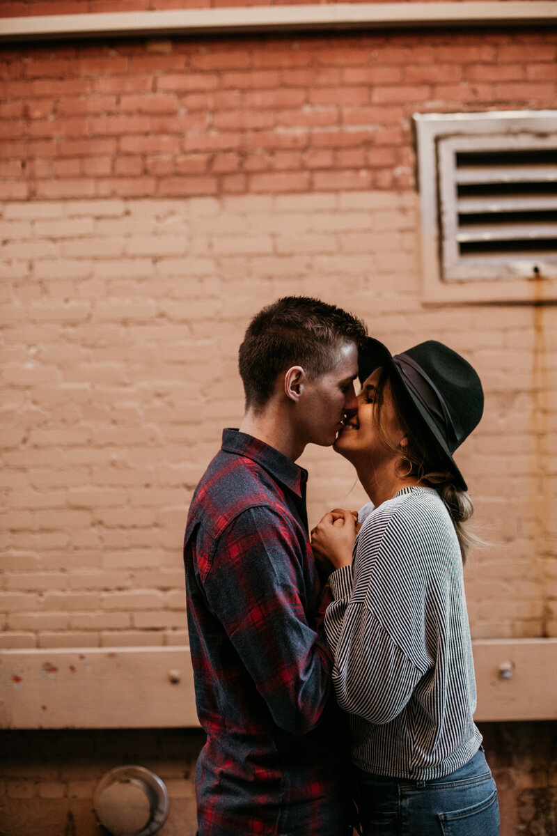 Couple kissing in an alley downtown Albuquerque