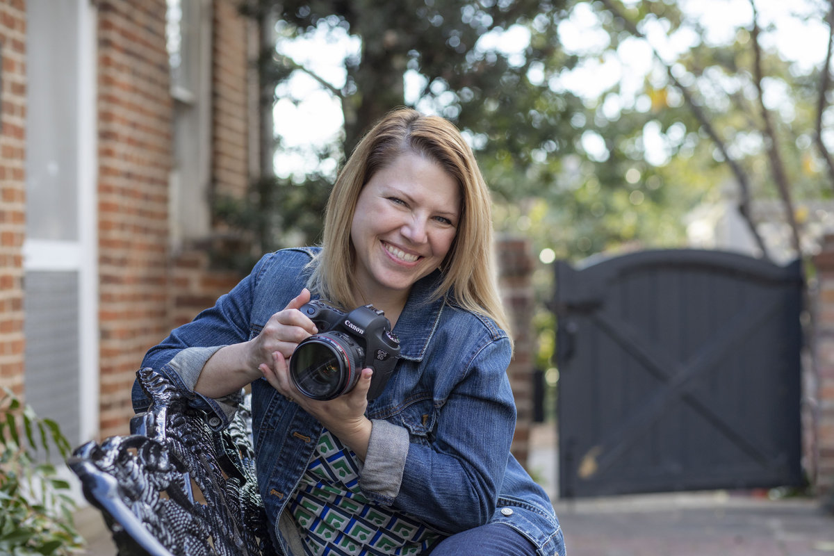 monroe_photographer_a_focused_life_photography_personal_brand_photo_branding_athens_founders_garden_photographer_smiling_holding_camera