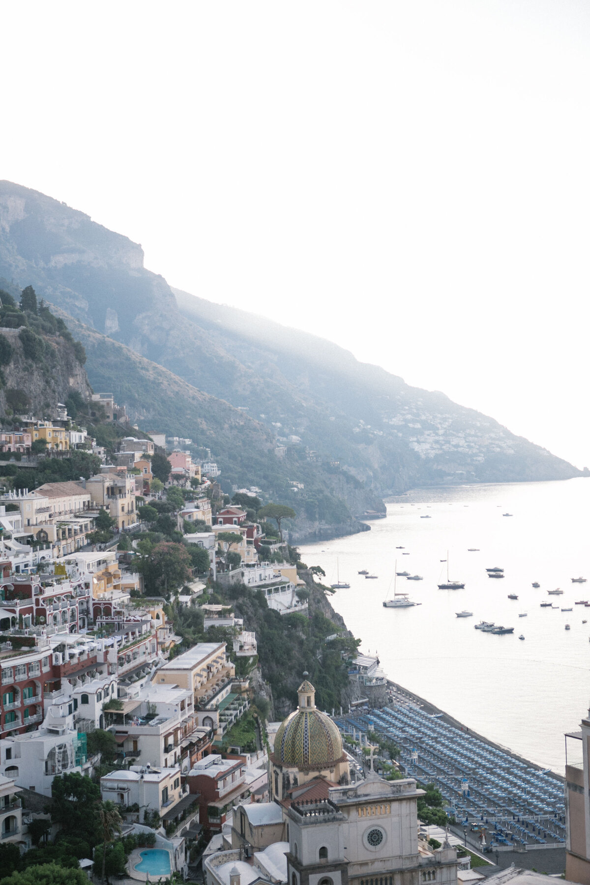 Aerial view of Positano coastline at golden hour – romantic destination wedding backdrop in Amalfi, Italy