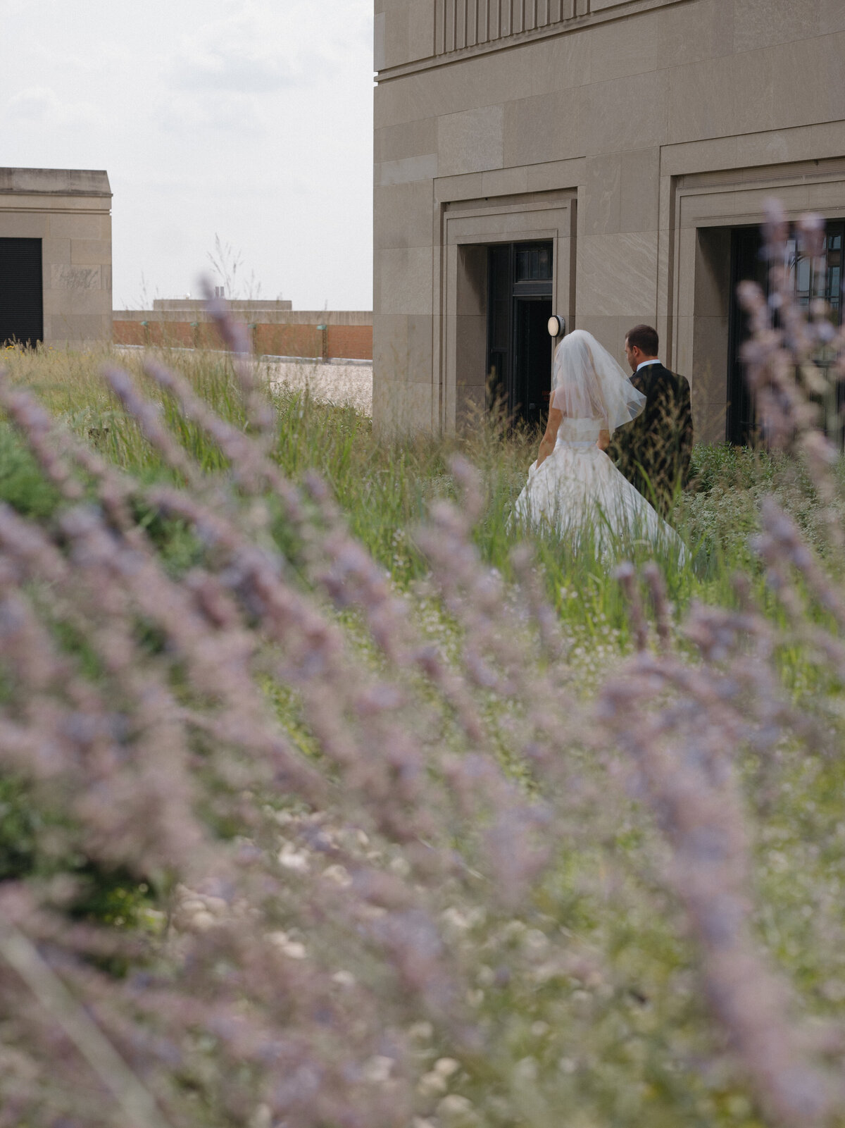 Fashion forward editorial wedding photography showcases ceremony elegance at Old Post Office Chicago, featuring Lauren Alatriste's sophisticated approach combining architectural beauty with magazine-worthy aesthetics and authentic wedding day  emotion.