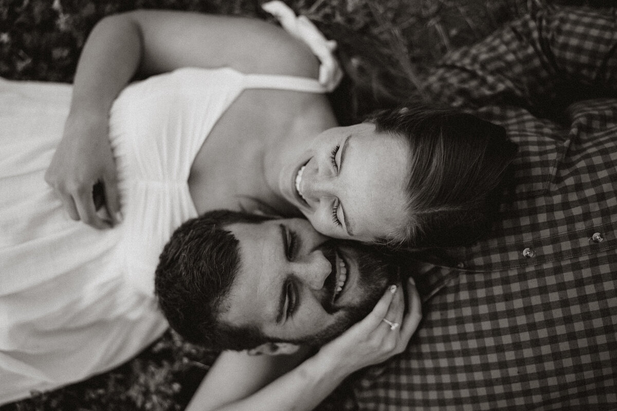 Close-up of couple laughing together during intimate mountain engagement session in Hoosier Pass.