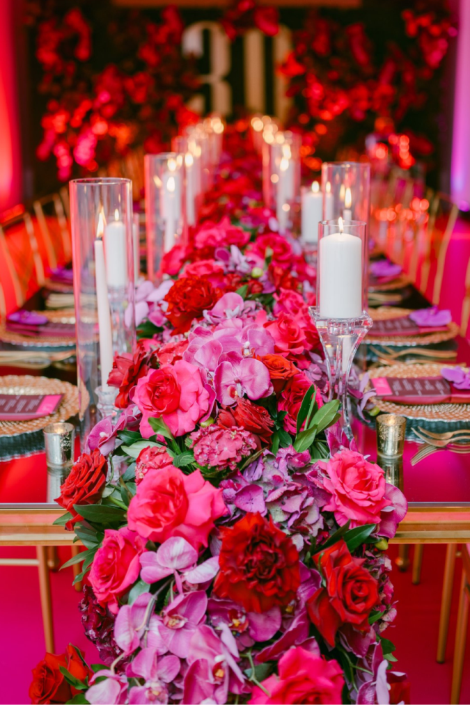 pink-party-birthday-thirty-floral-runner-roses-orchids-candles-gold-charger-chair-flower-wall-napkins