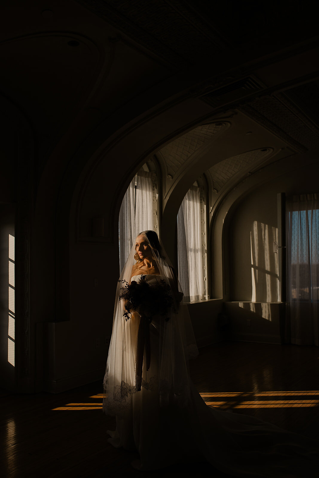 "Bride and groom celebrate their elegant luxury wedding at the historic Cottonwood Hotel in Omaha, NE – timeless moments captured by Tori Nichole Photography. A perfect blend of sophistication, romance, and architectural charm, showcasing the couple's love story in an unforgettable setting.