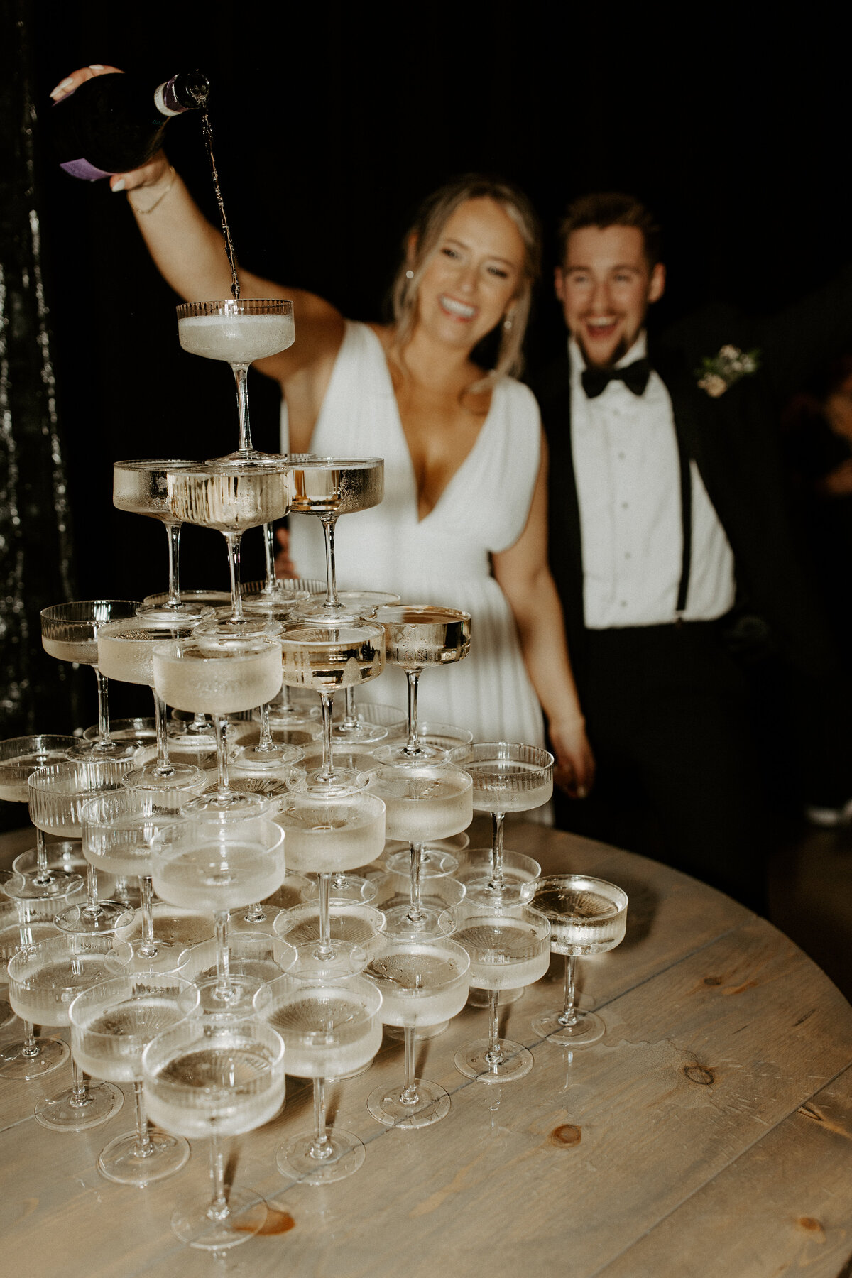 Champagne tower with bride and groom by Richmond VA wedding photographer