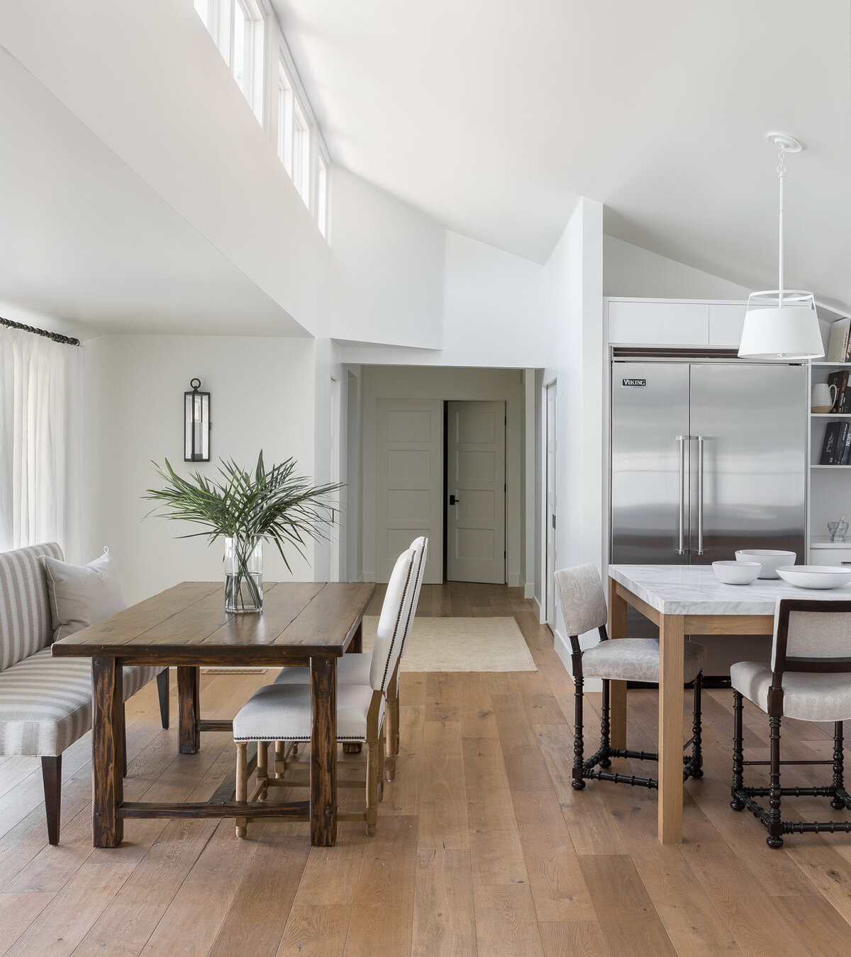bright-open-dining-area-wood-table-striped-bench