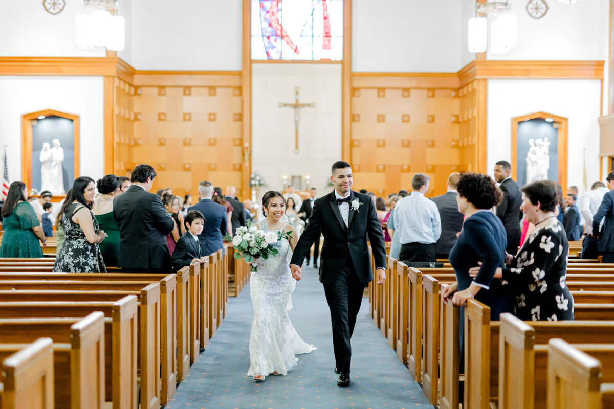 Bride and groom walking down the aisle