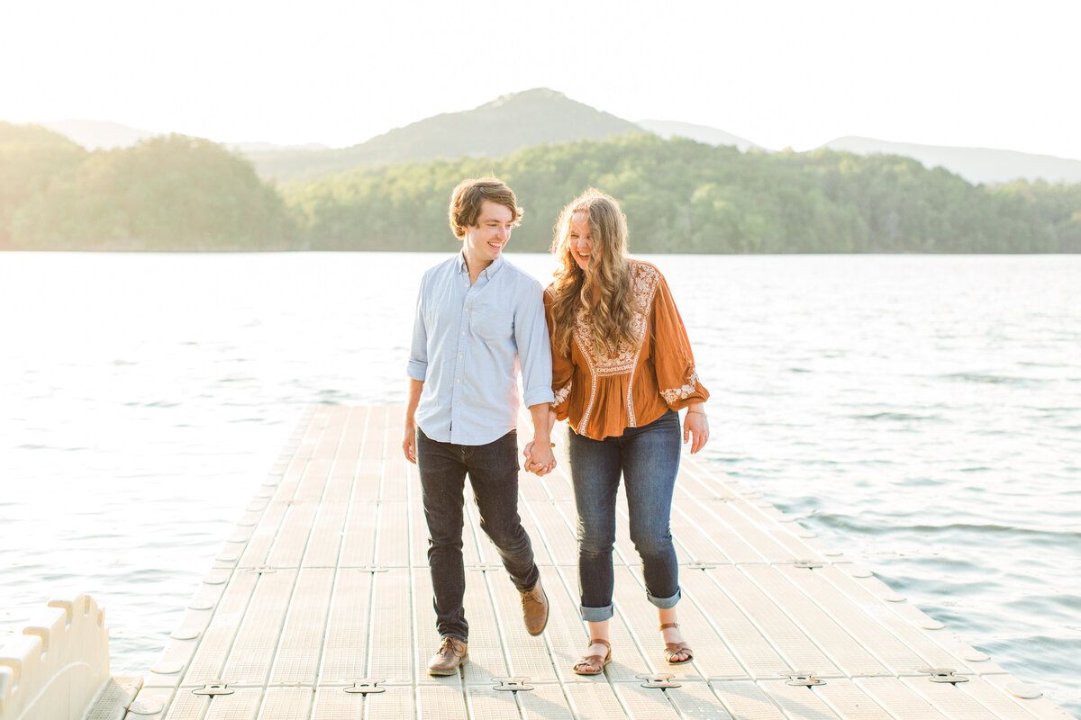 couple walking together on pier