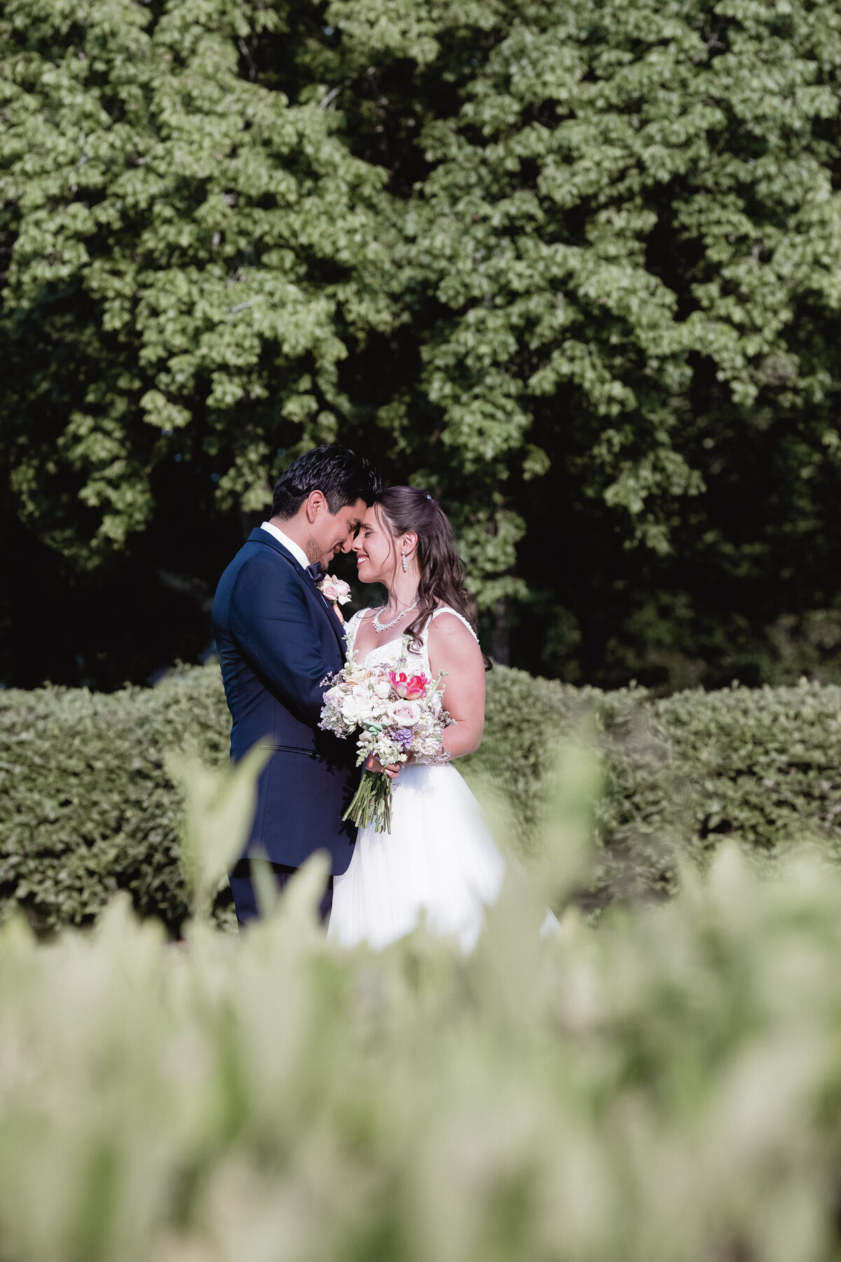 atlanta-couple-romantic-garden-wedding-hedge-backgroun