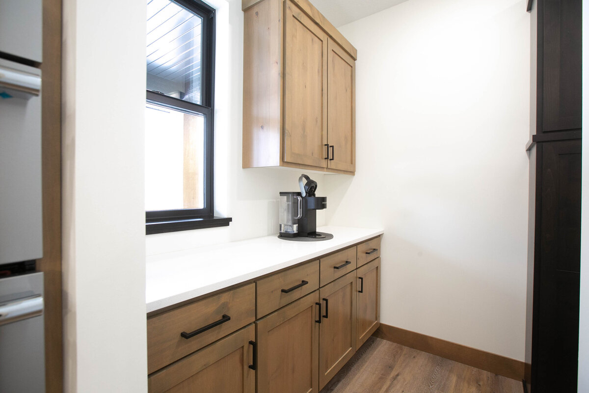 Custom bathroom with with dark cabinets and modern finishes in Elk River Custom Home.