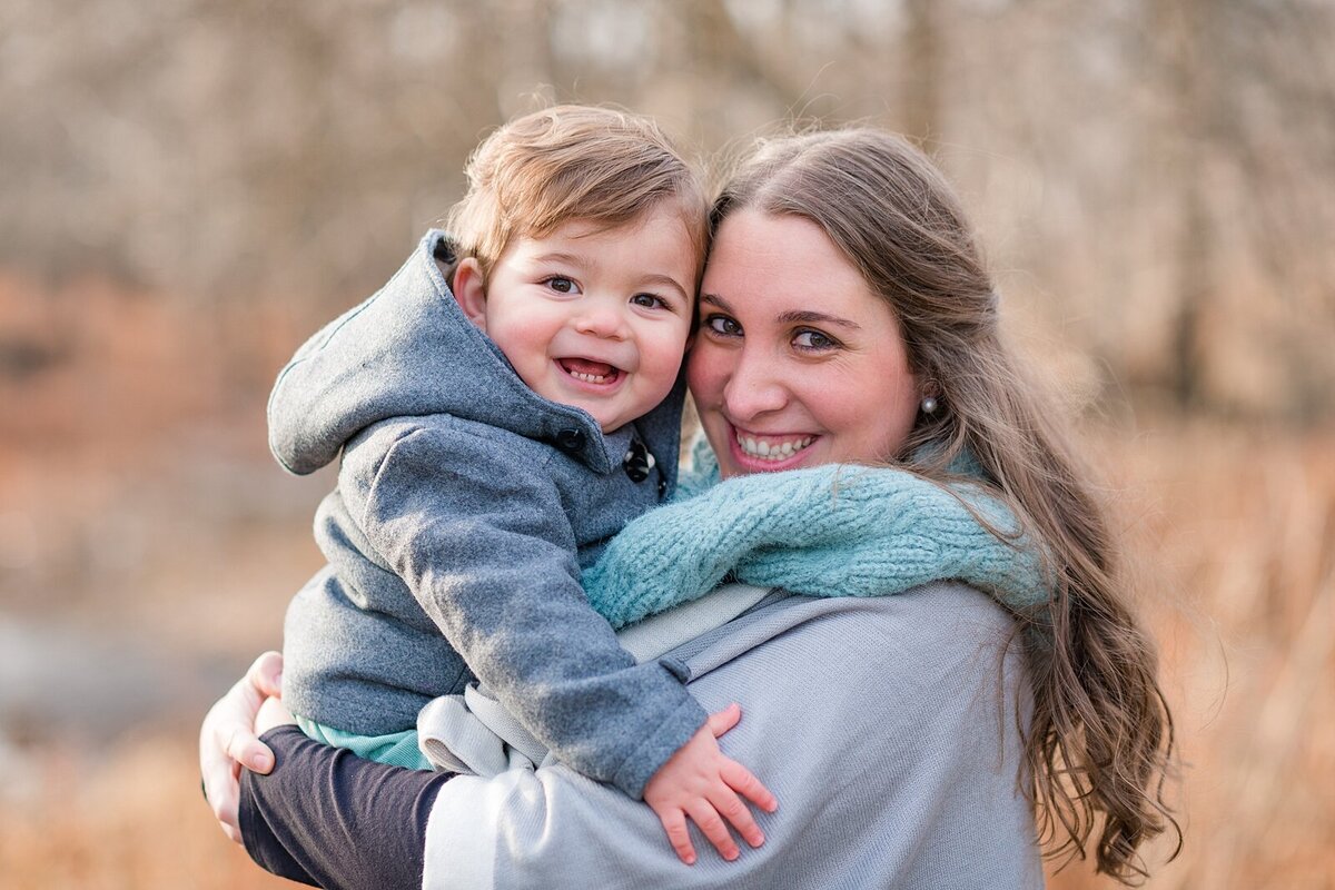 Mother holding her toddler son close by Oak Park maternity photographer Kristen Hazelton