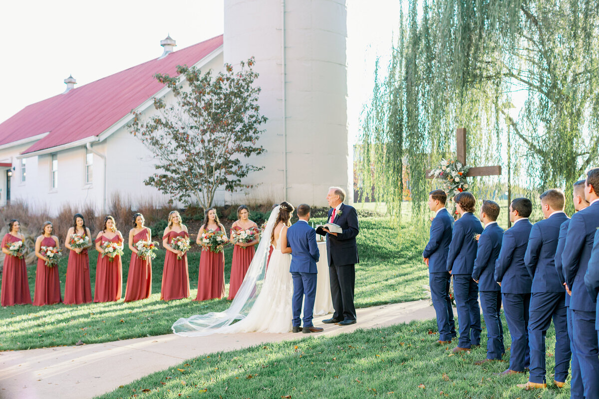 outdoor fall wedding ceremony at timeless wedding venue