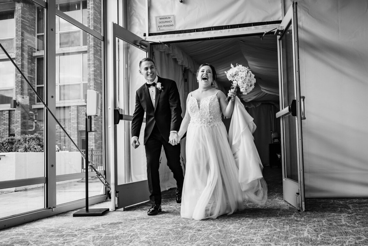Bride and Groom make an entrance at their wedding reception