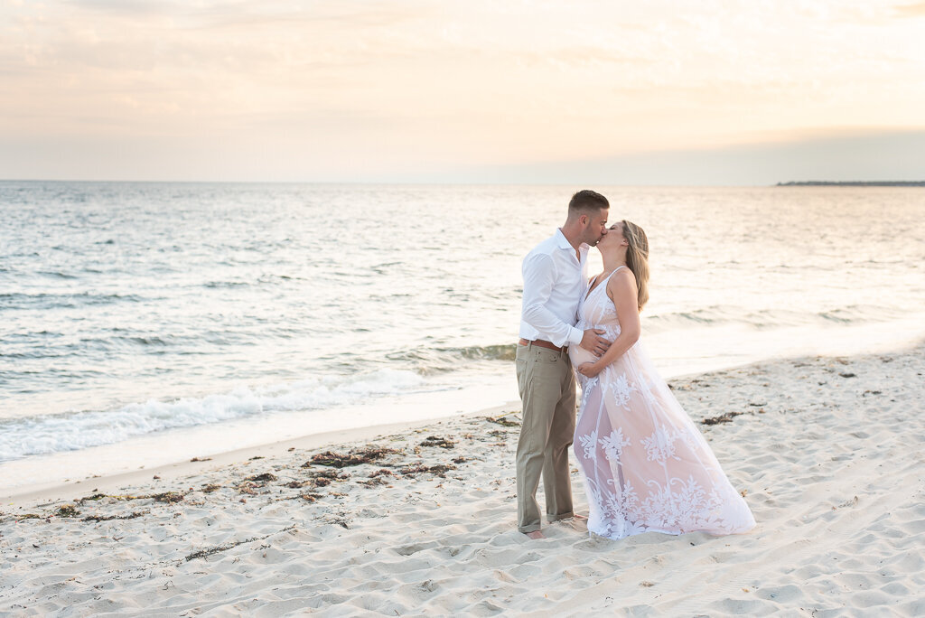 Couple kissing a maternity session at the beach |Sharon Leger Photography || Canton, CT || Family & Newborn Photographer
