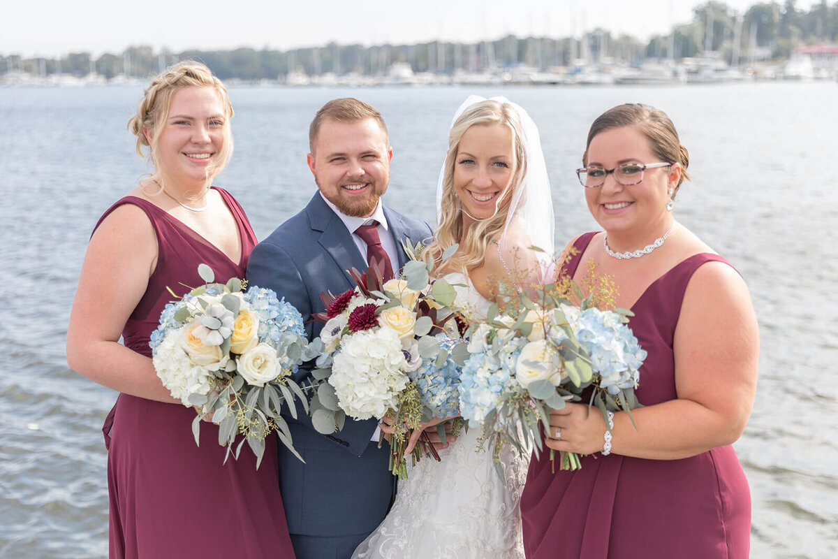 bridal party in plum dresses