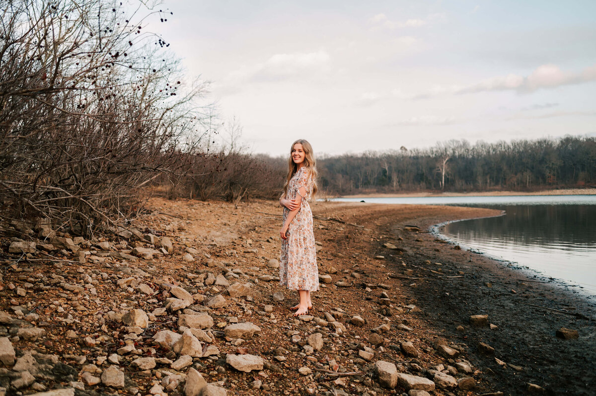 Branson Missouri senior photographer Jessica Kennedy of The Xo Photography captures teen girl smiling in sand