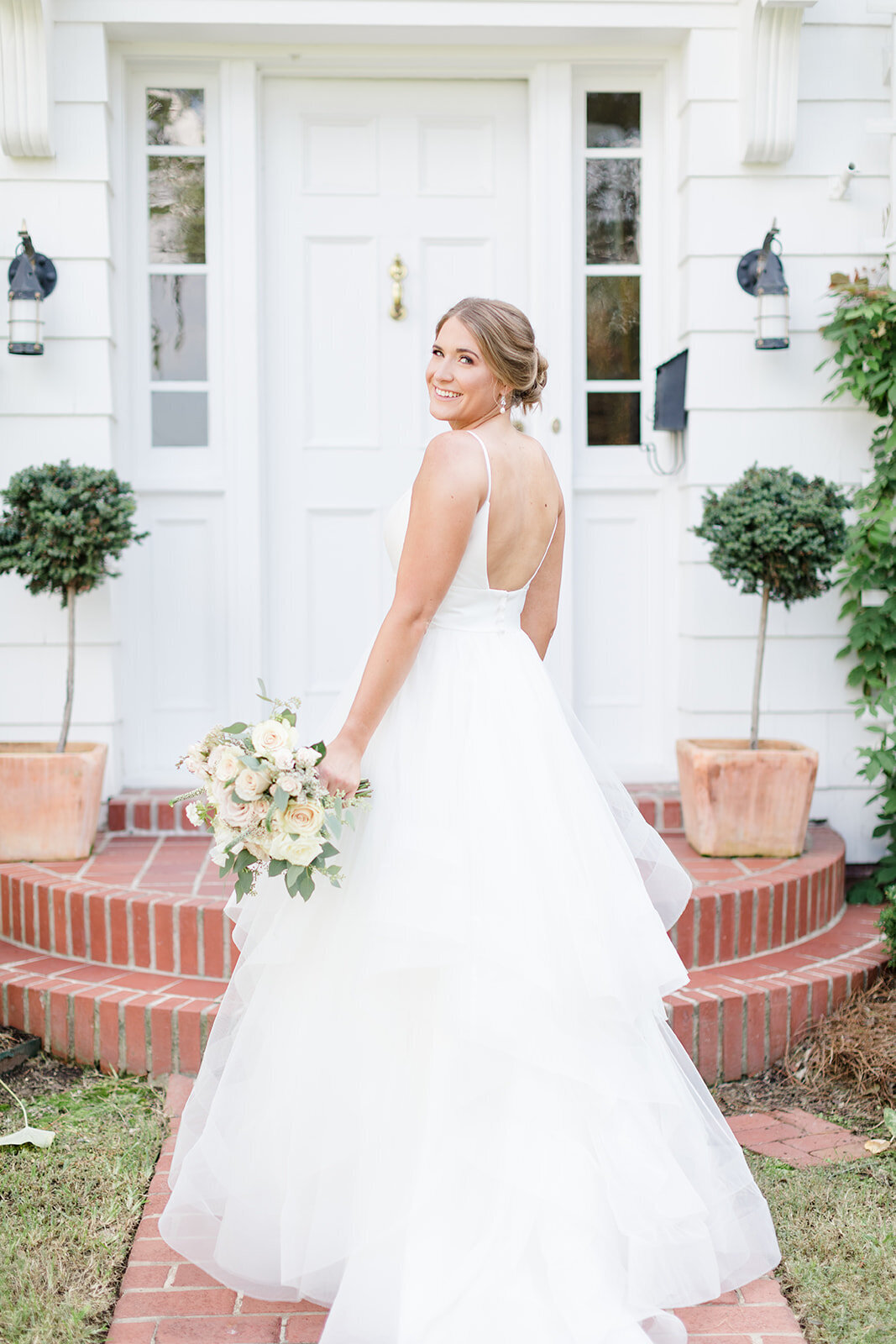 bridal portrait in front of house