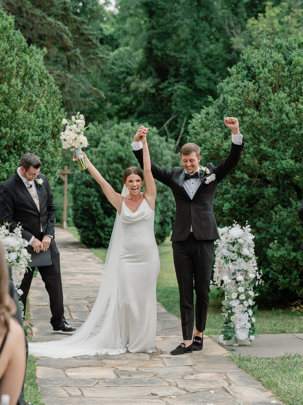 Rust Manor House Wedding | bride and groom celebrate after being pronounced husband and wife