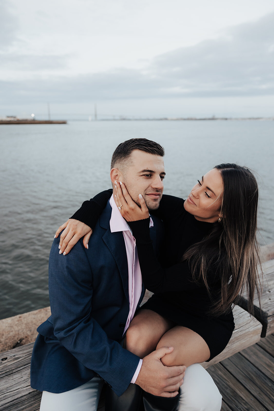 Couple during engagement photo at Public Pier in Charleston