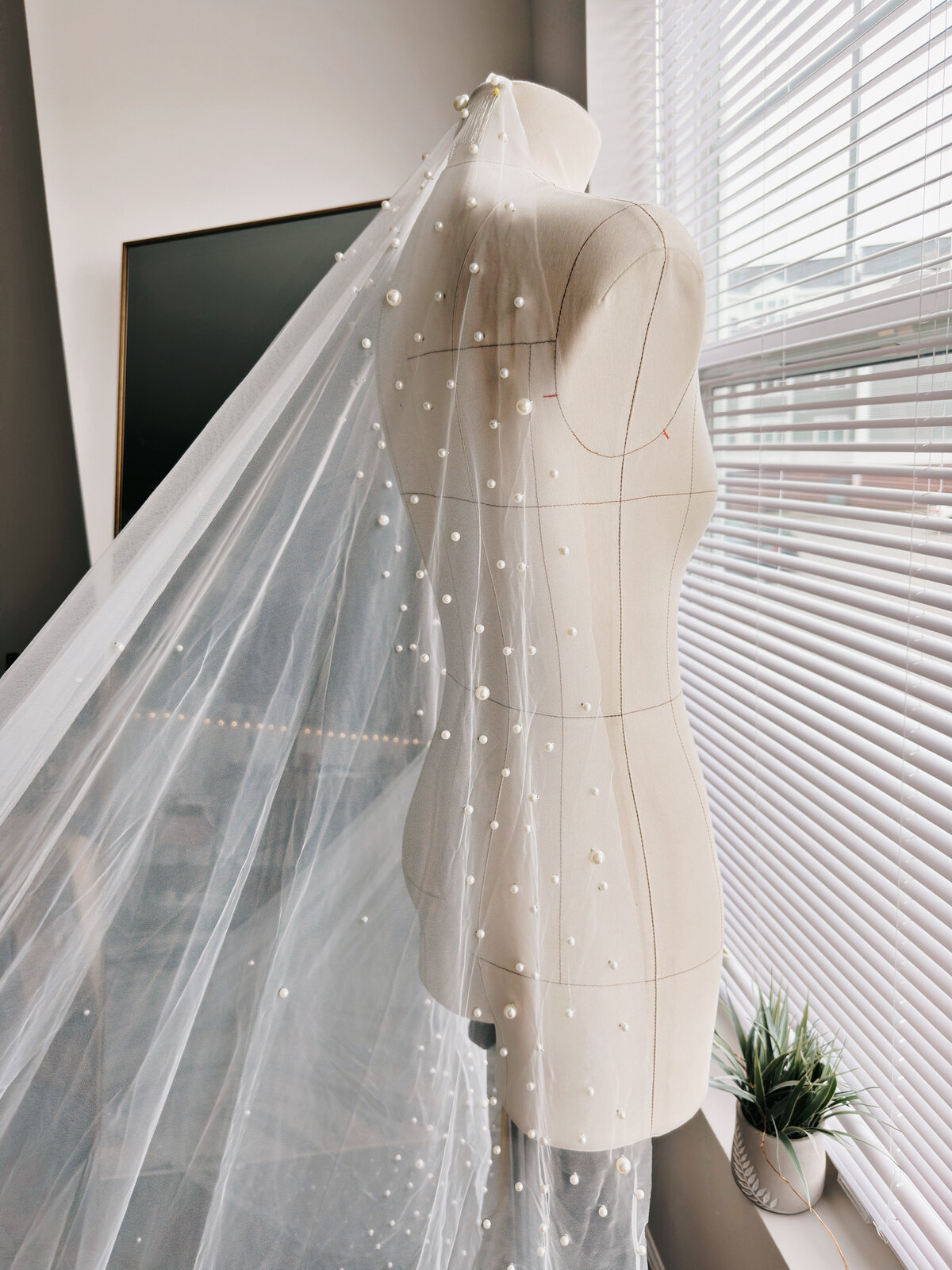 Dreamy bridal veil with fine beading and airy tulle drape
